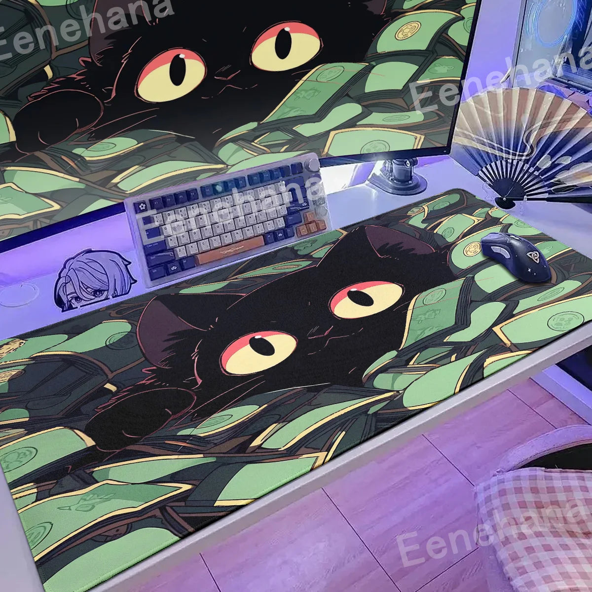 Desk setup with a large black Kawaii cat design mouse pad, keyboard, and monitor.