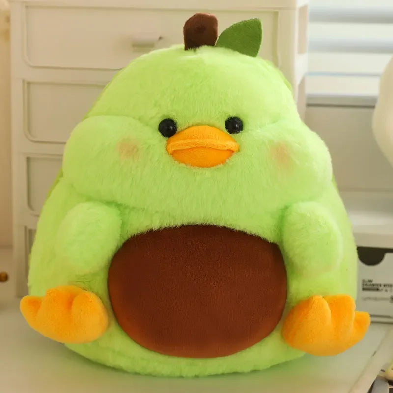 Green kawaii plush toy resembling a chick with brown and orange accents on a white surface.