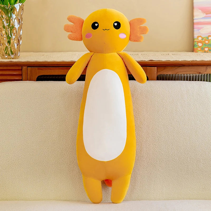 Yellow kawaii plush toy with a white belly on a beige couch
