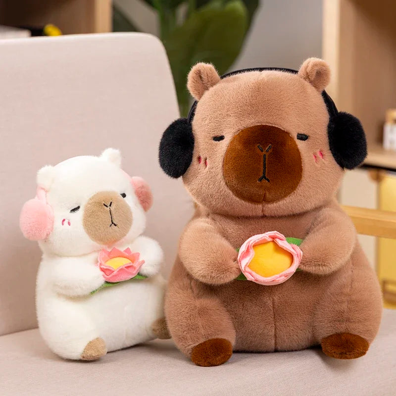 Two kawaii plush toys, one white and one brown, holding flowers on a light-colored surface.