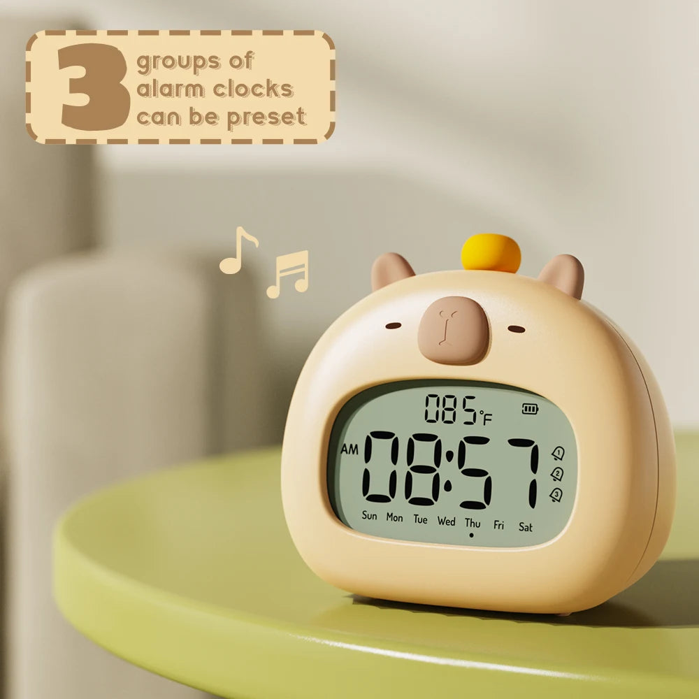 Children's kawaii alarm clock with cartoon design on a light surface
