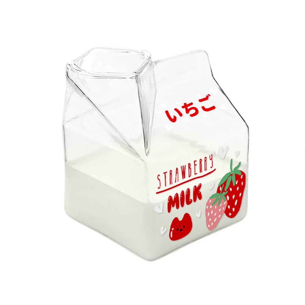 Clear Kawaii container shaped like a strawberry milk carton with red text and strawberry illustrations on a white background