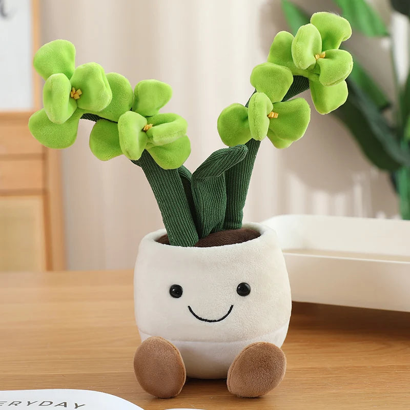 Plush kawaii toy plant in a white pot with a smiley face on a wooden surface