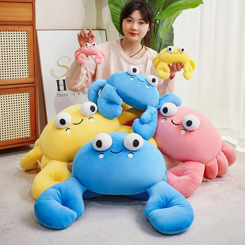 Woman holding colorful kawaii plush crab toys in a room with plants and furniture.