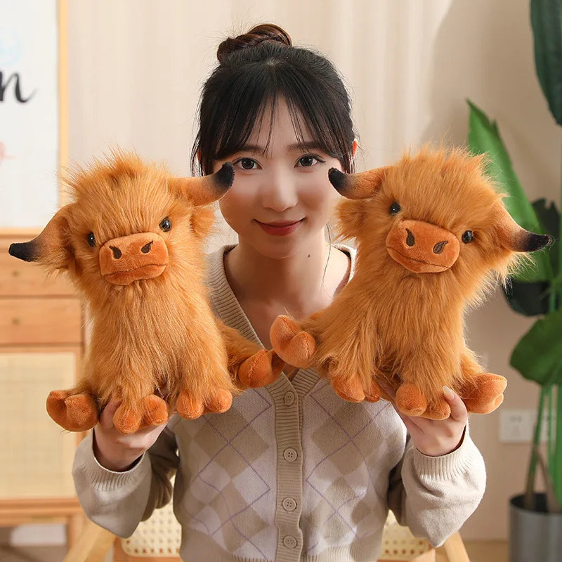 Person holding two fluffy orange kawaii plush toys in a home setting