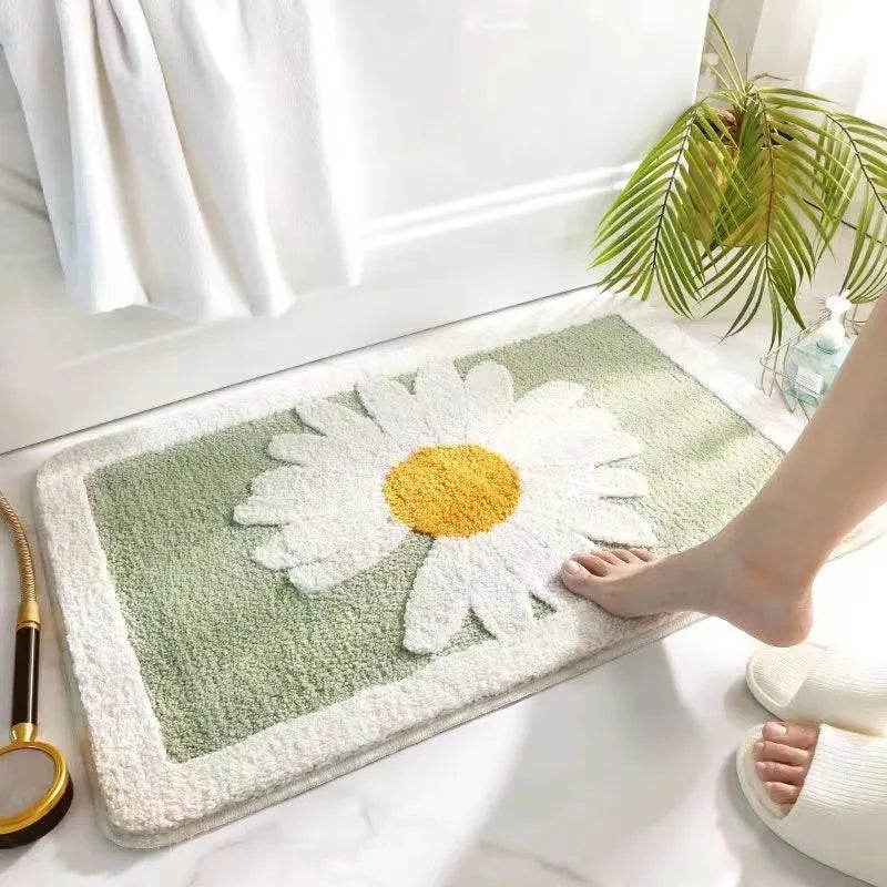 Doormat with a Kawaii daisy design on a white floor next to a plant