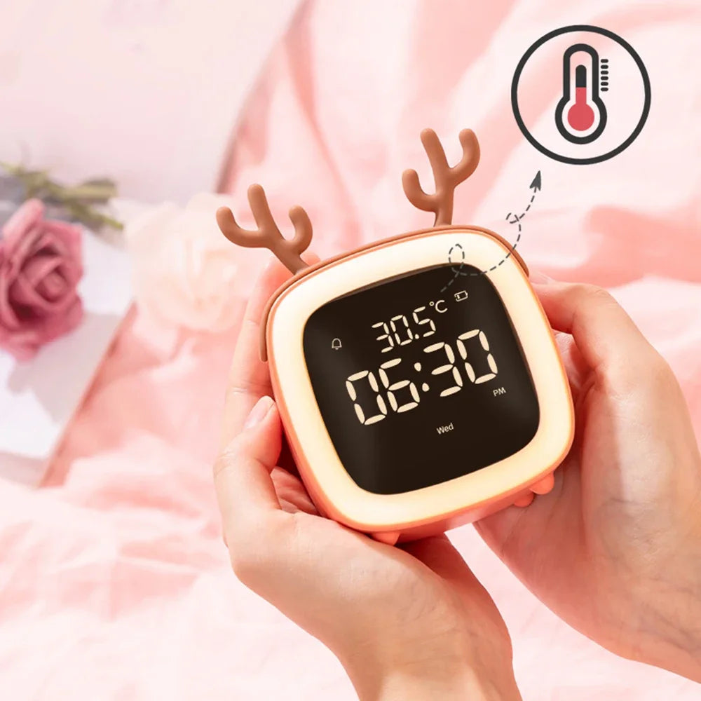 Kawaii digital clock with deer design held by hands, showing time and temperature.