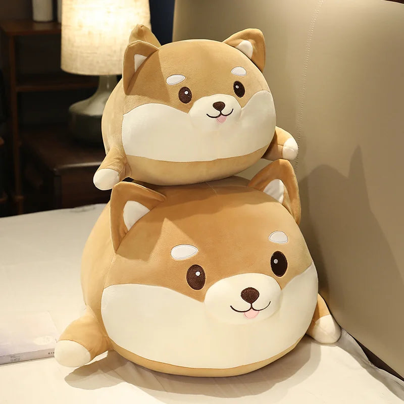 Two stacked plush dog kawaii toys on a surface with a blurred background