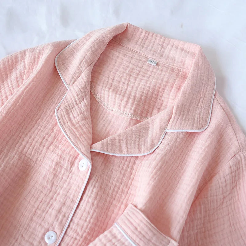 Pink textured kawaii shirt with white buttons on a light gray background