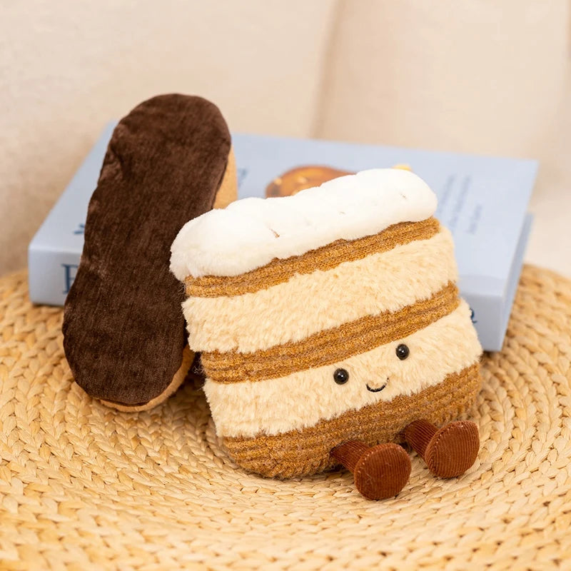 Plush kawaii toy resembling a s'more with a smiling face on a woven surface.