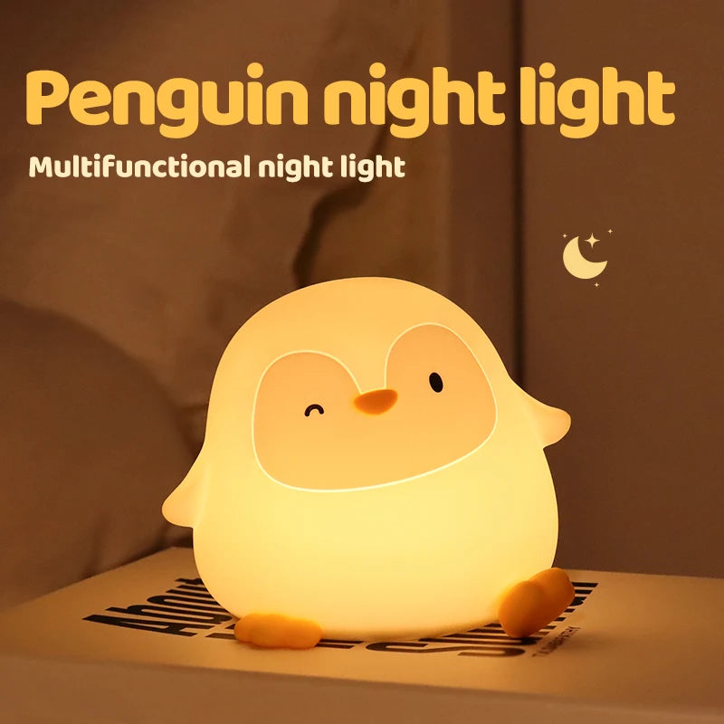 Penguin kawaii night light on a brown surface with a warm glow