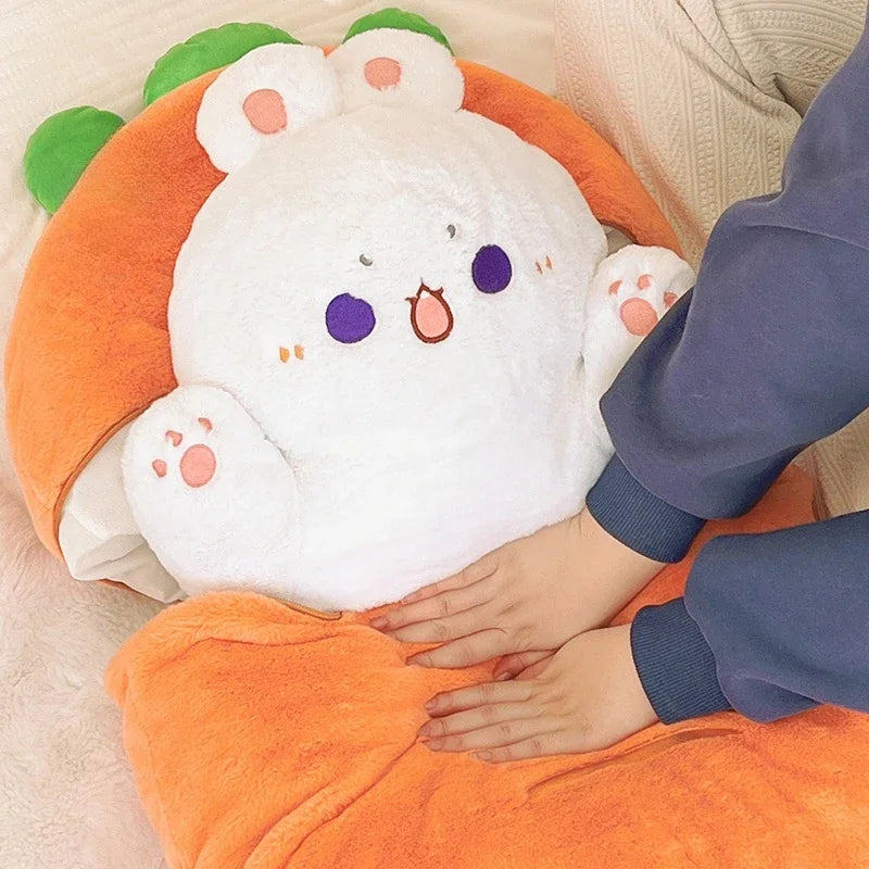 Plush toy resembling a white kawaii cat with purple eyes and pink cheeks, inside an orange shell.