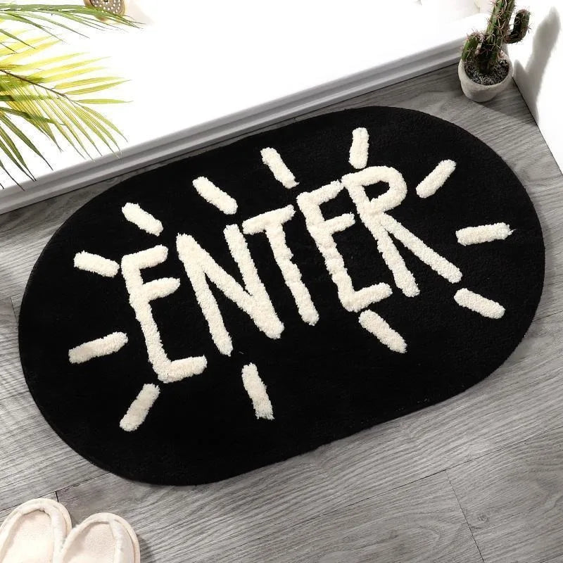 Black Kawaii doormat with 'ENTER' text on a wooden floor