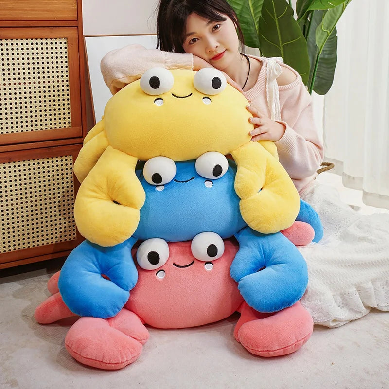 Person holding a colorful kawaii plush toy with multiple faces