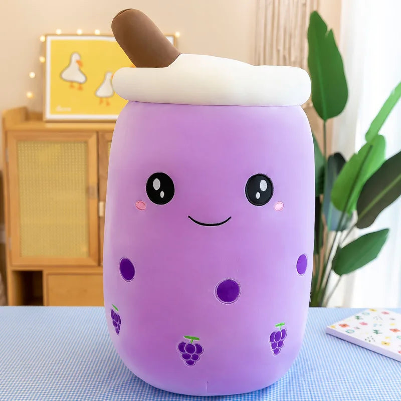 Kawaii purple plush toy with a smiling face on a table
