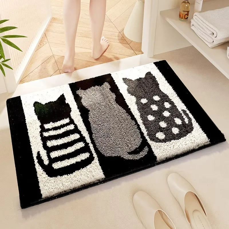 Decorative doormat with Kawaii cat designs on a floor, with a person stepping onto it.