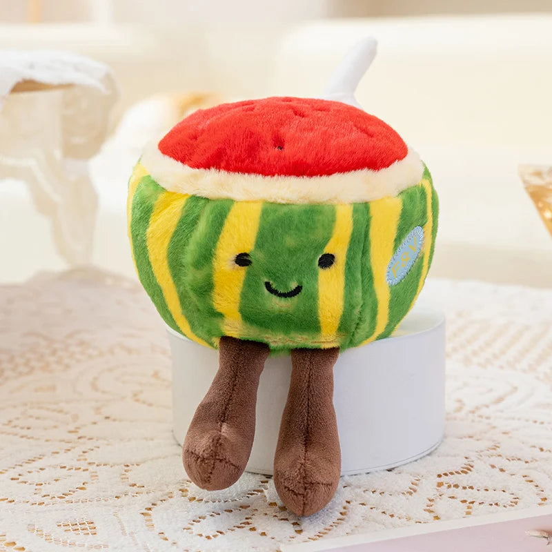 Plush kawaii toy resembling a watermelon with a smiling face on a white surface.