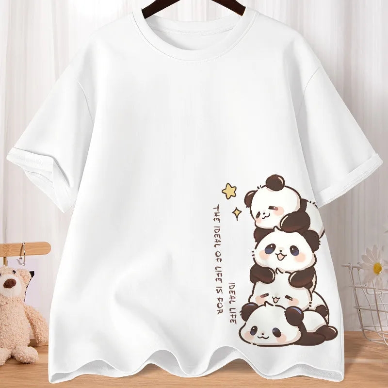 White t-shirt with kawaii panda design on a wooden surface