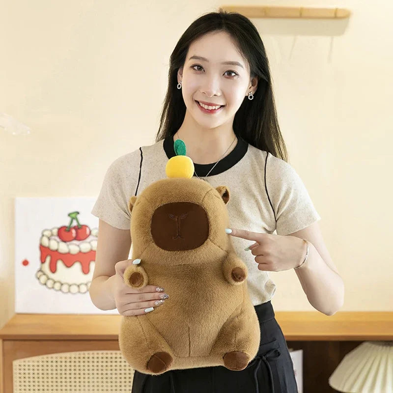 Woman holding a kawaii plush toy resembling a bear with a yellow object on its head, in a room setting.