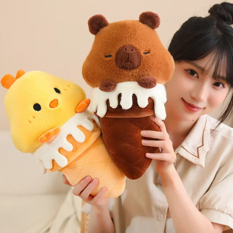 Person holding two cute kawaii plush toys shaped like a bear and a chick in an ice cream cone.