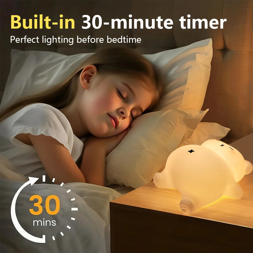 Child sleeping in bed with a kawaii night light and timer display.
