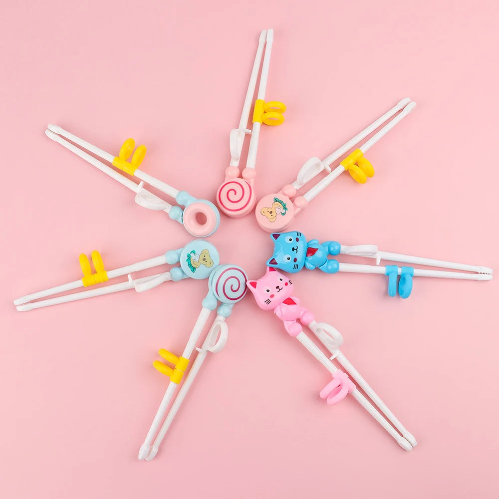 Set of colorful kawaii cartoon-themed chopsticks on a pink background