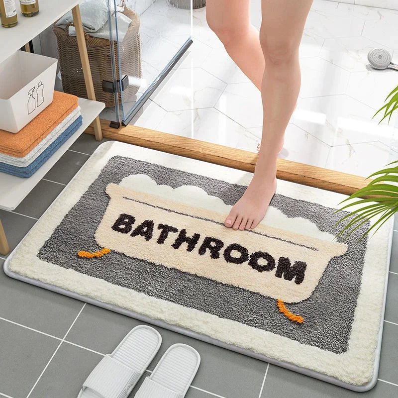 Kawaii-style bathroom mat with 'BATHROOM' text on a tiled floor