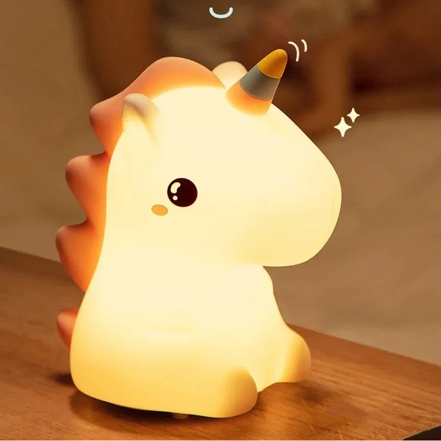 Kawaii unicorn-shaped night light on a wooden surface with a soft focus background