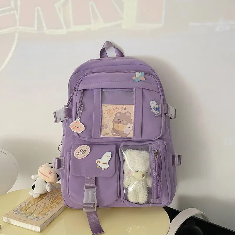 Kawaii purple backpack with decorative elements on a white surface