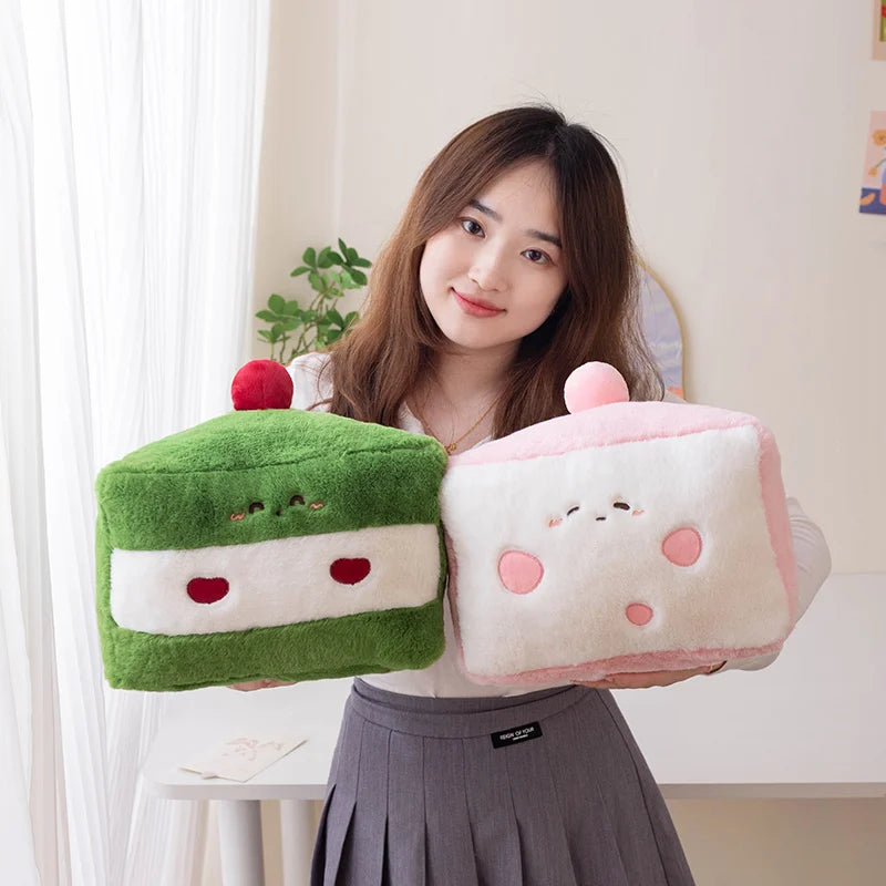 Woman holding two cute plush kawaii toys resembling cake and donut shapes.