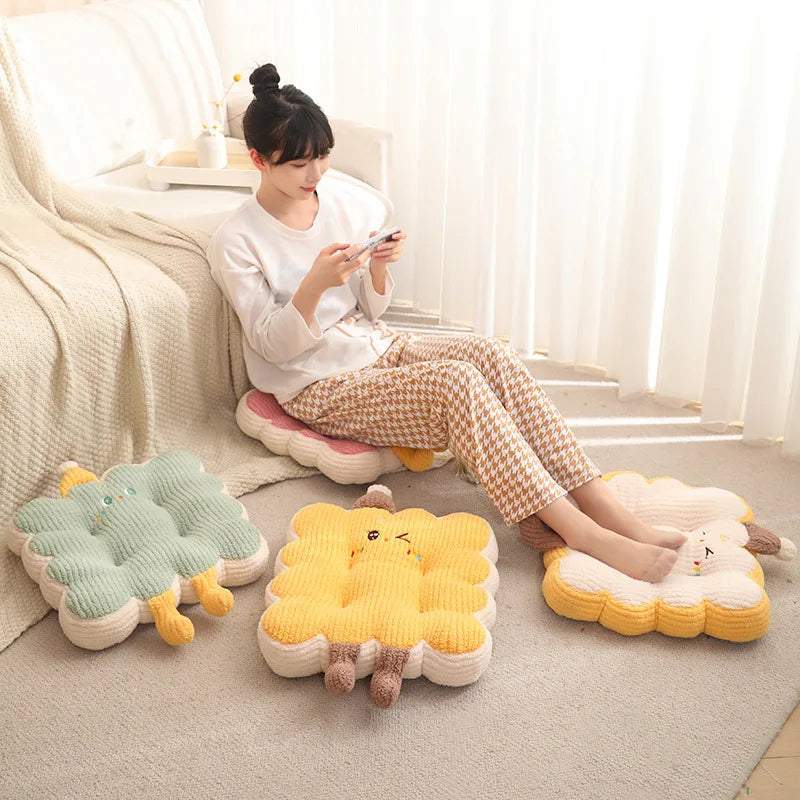 Woman sitting on a kawaii cushion with cartoon animal designs in a bright room.