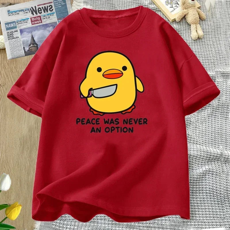 Red t-shirt with a yellow kawaii duck graphic and text on a textured surface.