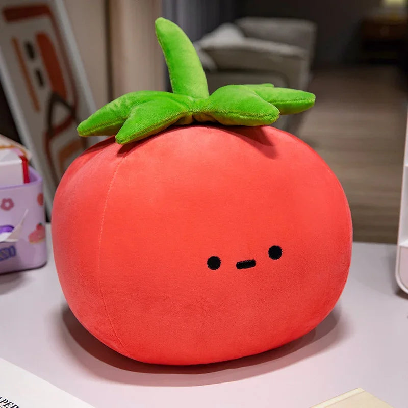 Plush kawaii toy shaped like a tomato with a face on a table