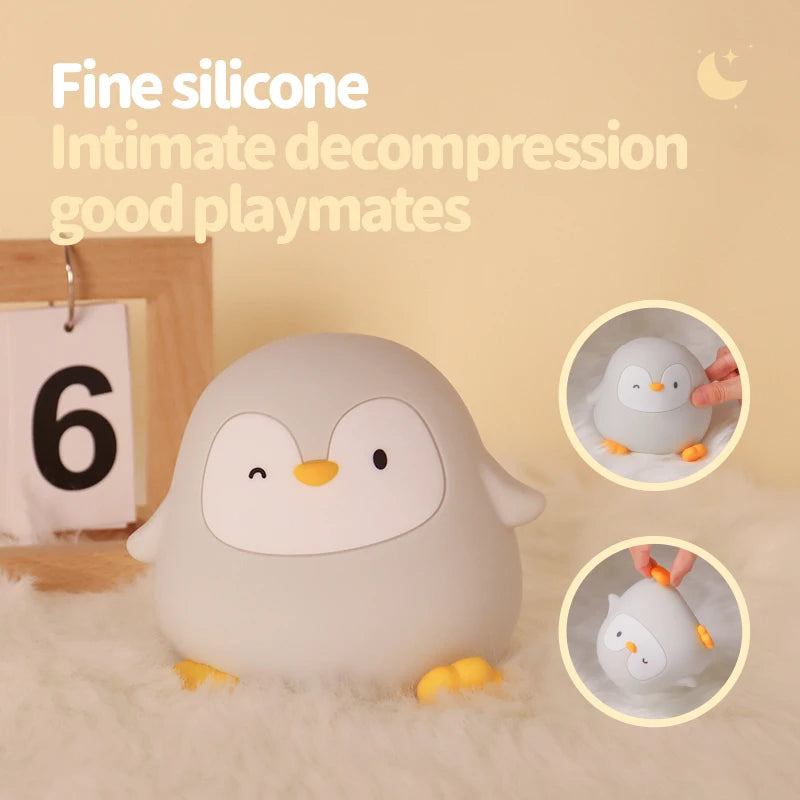 Penguin-shaped kawaii toy with text about 'Fine silicone' and 'Intimate decompression good playmates' on a beige background.