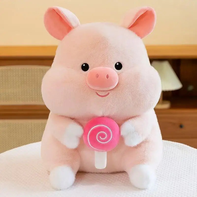 Kawaii plush toy pig holding a pink lollipop on a white surface.