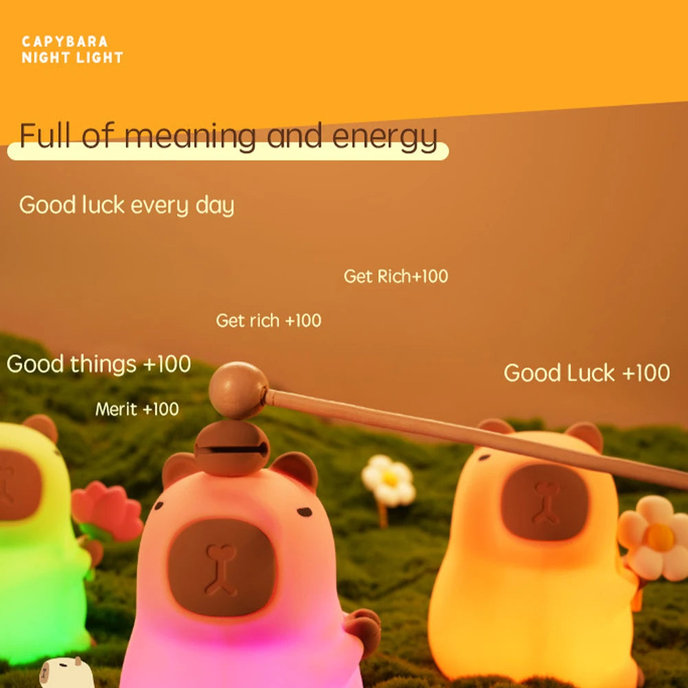 Kawaii capybara night light with colorful design and text on an orange background