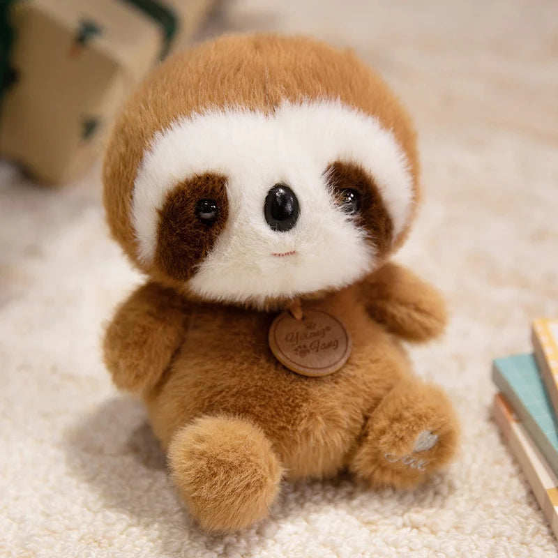 Plush kawaii toy sloth with a tag on a soft surface