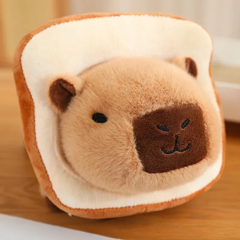 Kawaii plush toy shaped like a slice of bread with a bear face on a wooden surface.