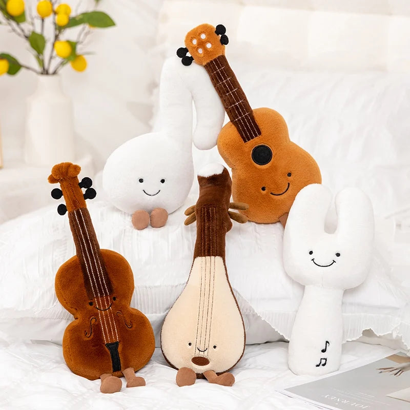 Plush kawaii toys resembling musical instruments and characters on a white background