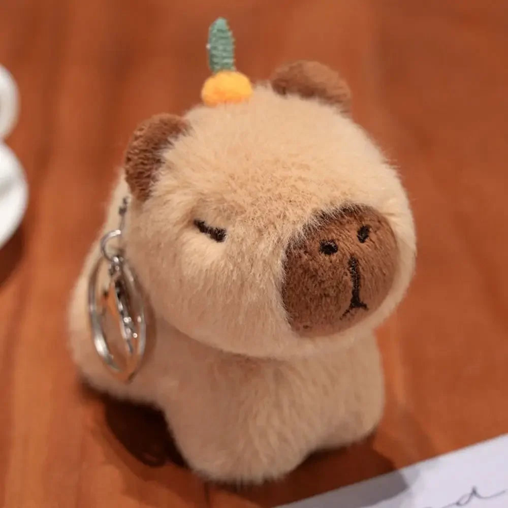 Plush kawaii bear keychain with a small hat on a brown background