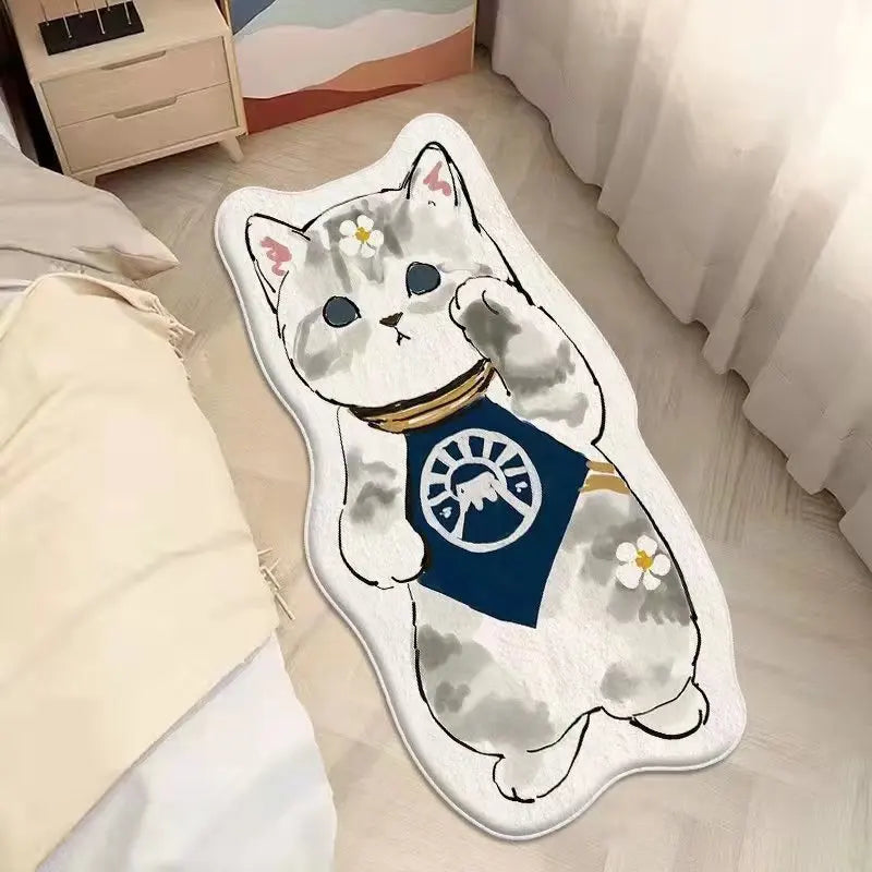 Kawaii cat-shaped rug with a blue emblem on a bed