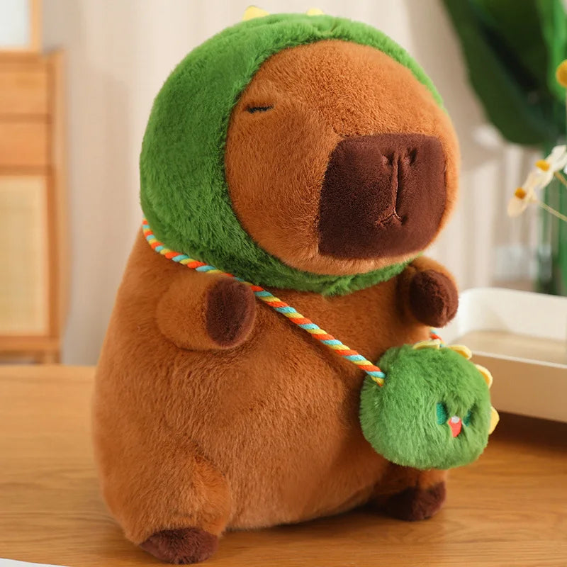Kawaii plush toy bear in a green hat with a small green dragon on a wooden surface