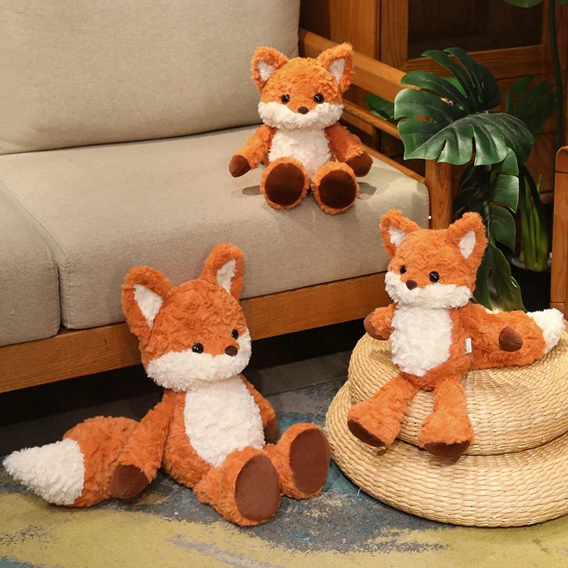 Three fox plush kawaii toys in a living room setting with a sofa and plant.