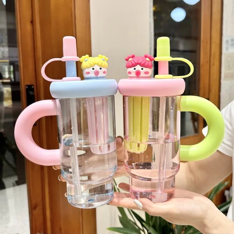 Two colorful water bottles with Kawaii cartoon character lids held by a person.
