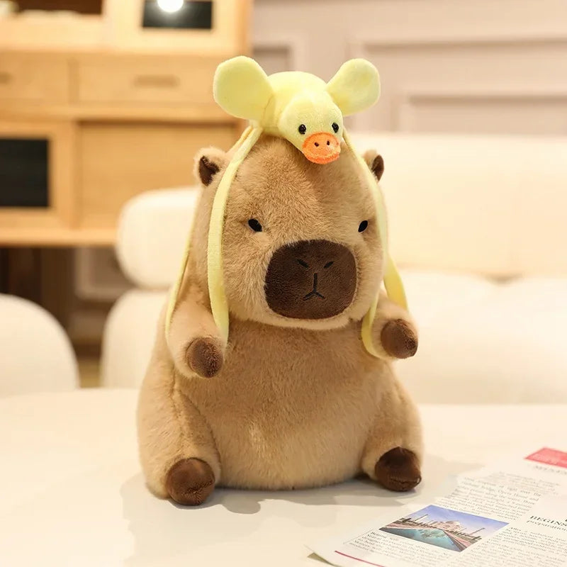 Kawaii plush toy with a yellow hat on a white surface