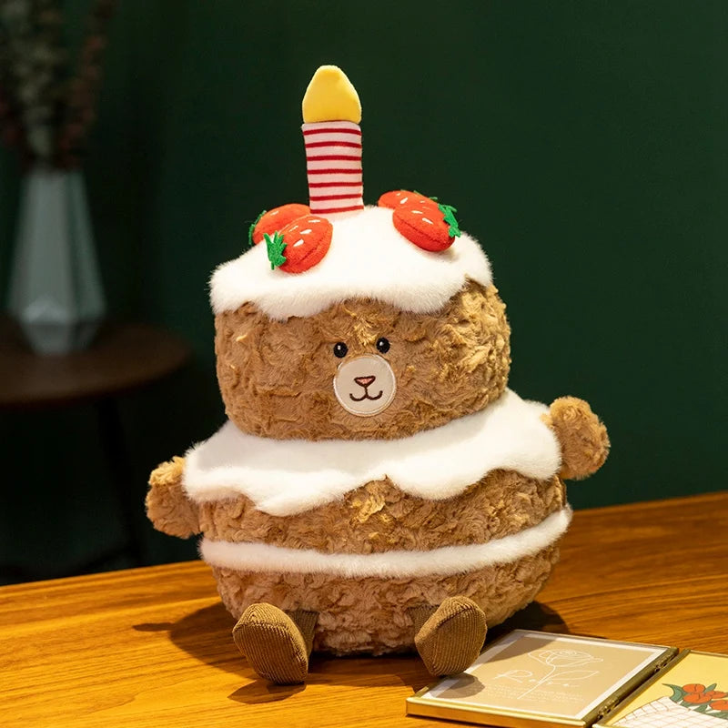 Plush kawaii toy resembling a birthday cake with a candle on a wooden surface