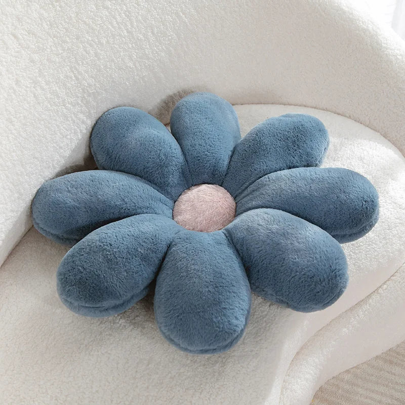 Blue Kawaii flower-shaped cushion on a white surface