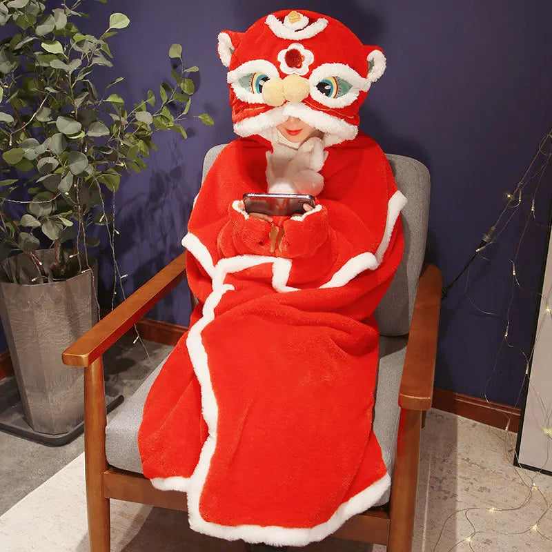 Person wearing a kawaii red plush costume with a mask, sitting on a chair holding a phone.