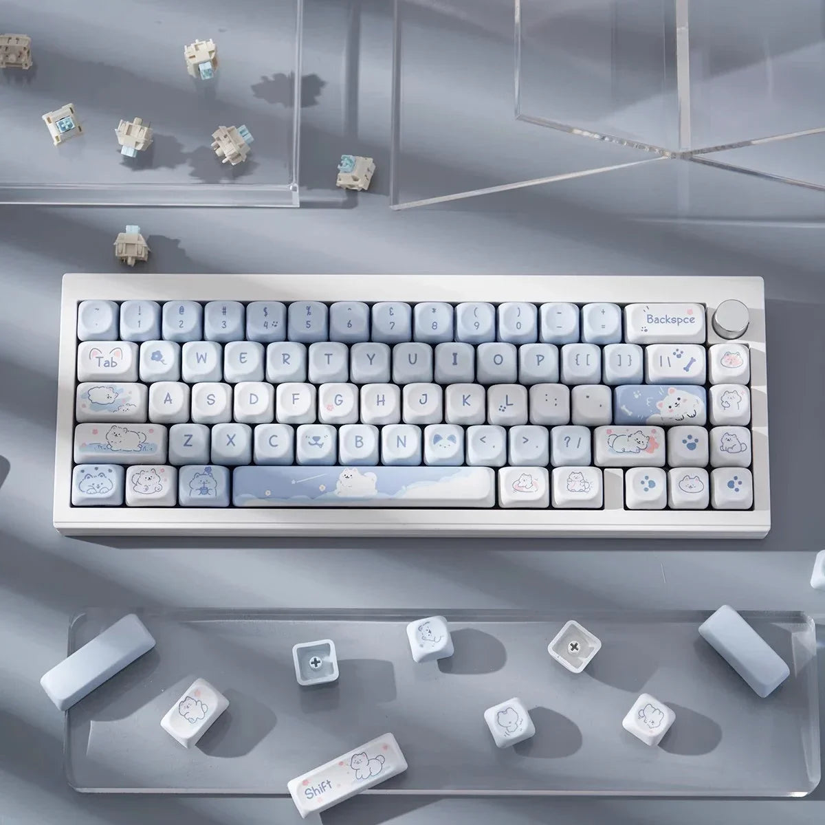 Mechanical keyboard with decorative Kawaii keycaps on a gray surface