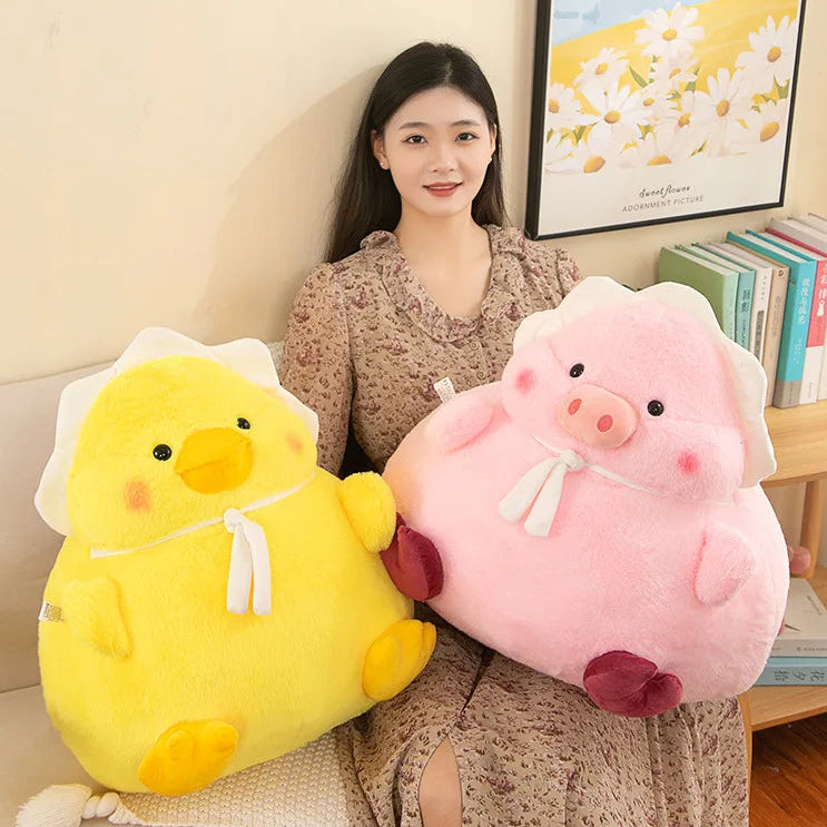 Woman holding a yellow chick and pink pig kawaii plush toy in a room with books and a picture frame.